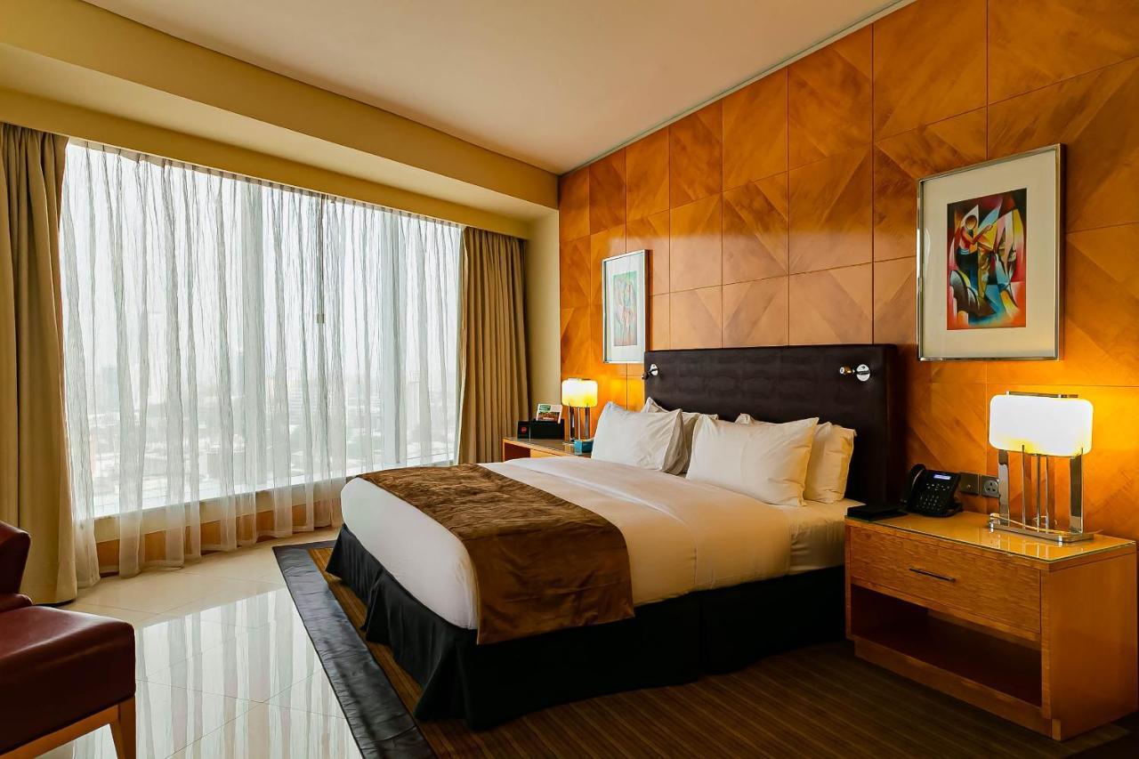 Lagos Continental Hotel Exterior foto A bedroom at the Ritz-Carlton, Dubai